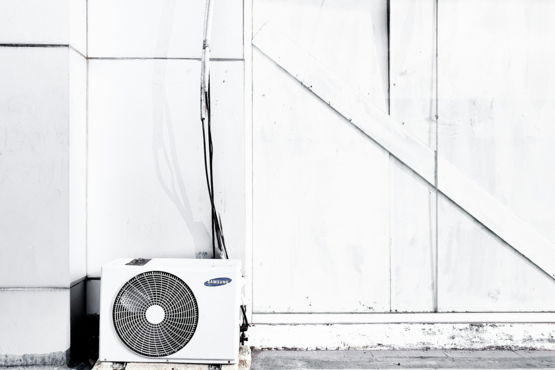 grayscale photography of outdoor AC unit